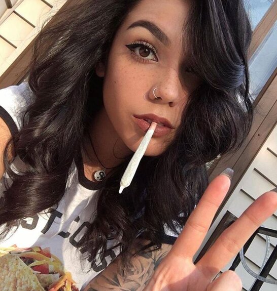 attractive brunette smoking joint