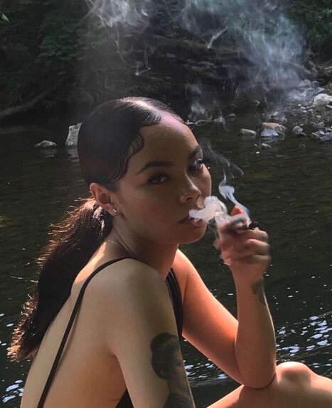beautiful girl smoking marijuana joint