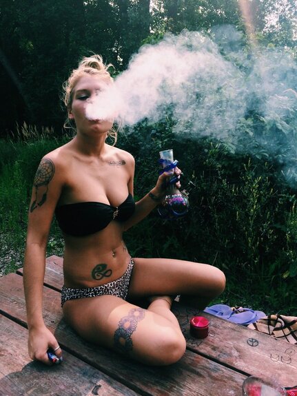 blonde girl in bikini smoking bong