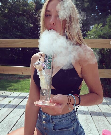 cute blonde girl smoking weed bong