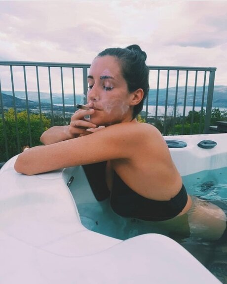 cute girl in hot tub smoking weed