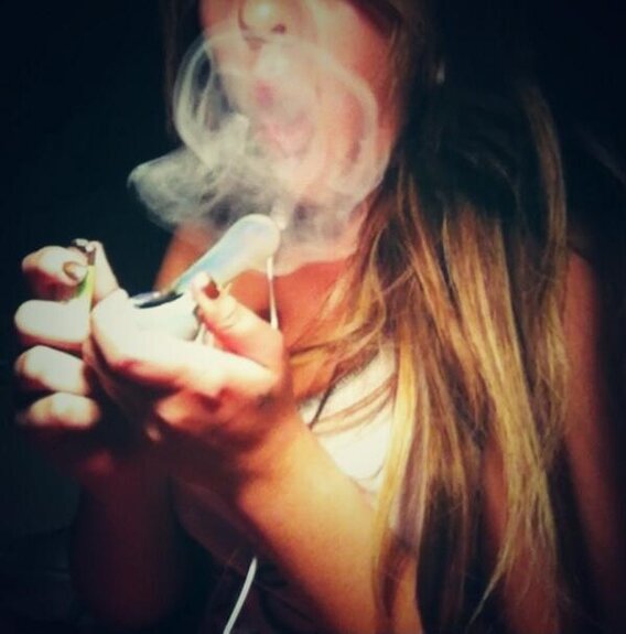 girl smoking from pipe