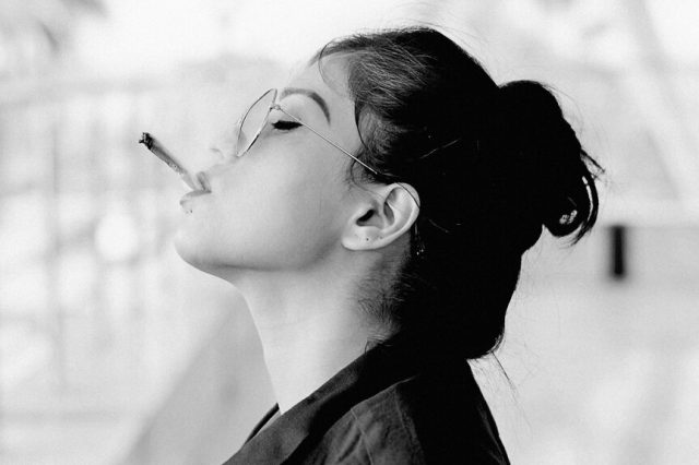 girl smoking joint black and white