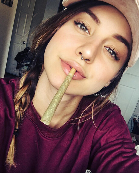 pretty brunette girl smoking weed